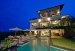 View of villa from swimming pool at night